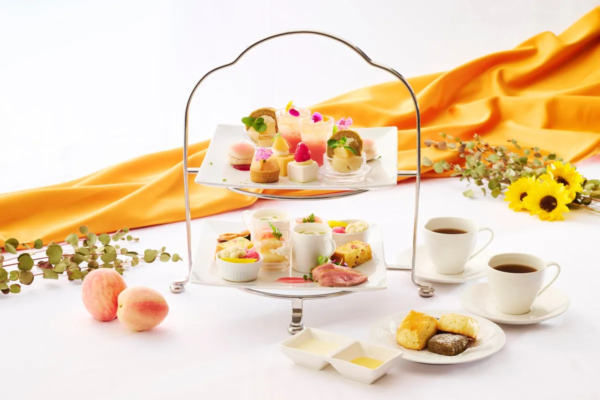 Afternoon tea set with peaches and honey