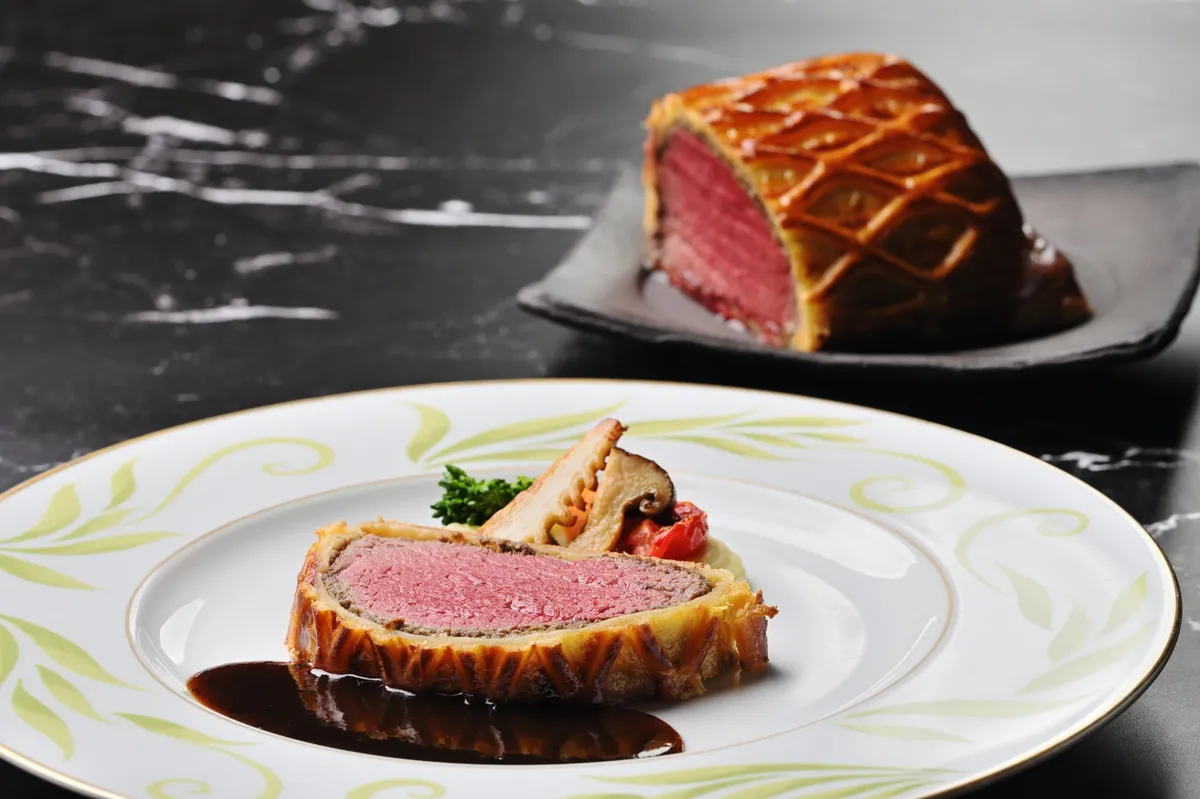 Beef Wellington served with a rich sauce