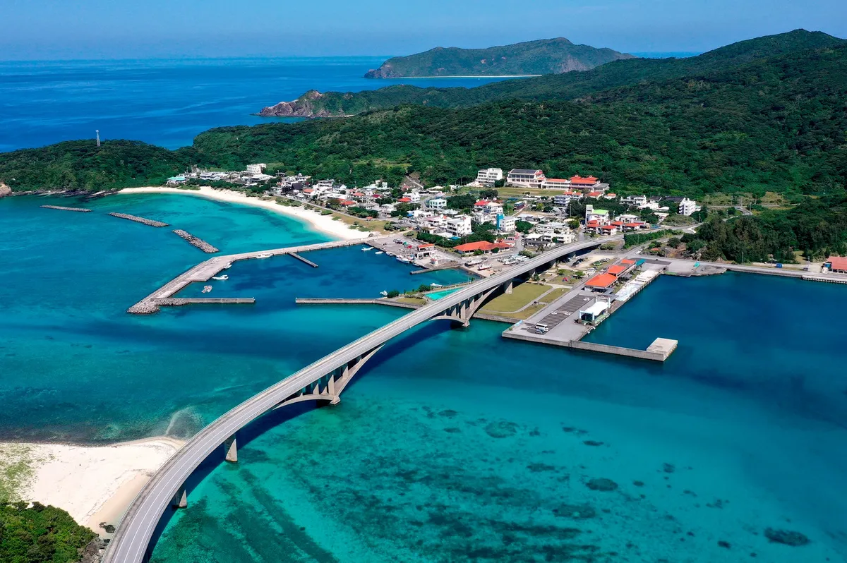 Aerial view of a bridge connecting islands over turquoise water