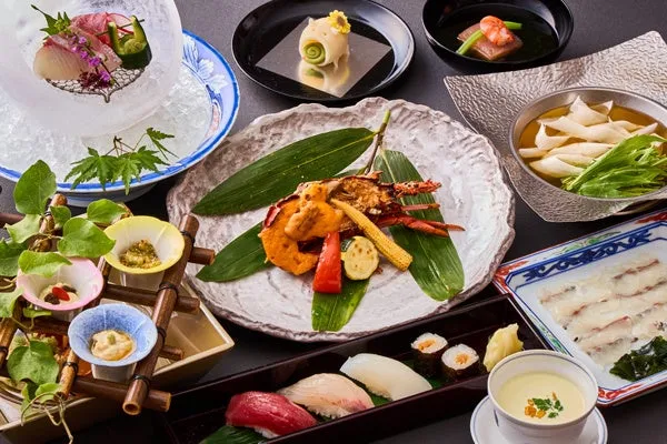 The July kaiseki spread featuring Hamo shabu-shabu and seasonal appetizers