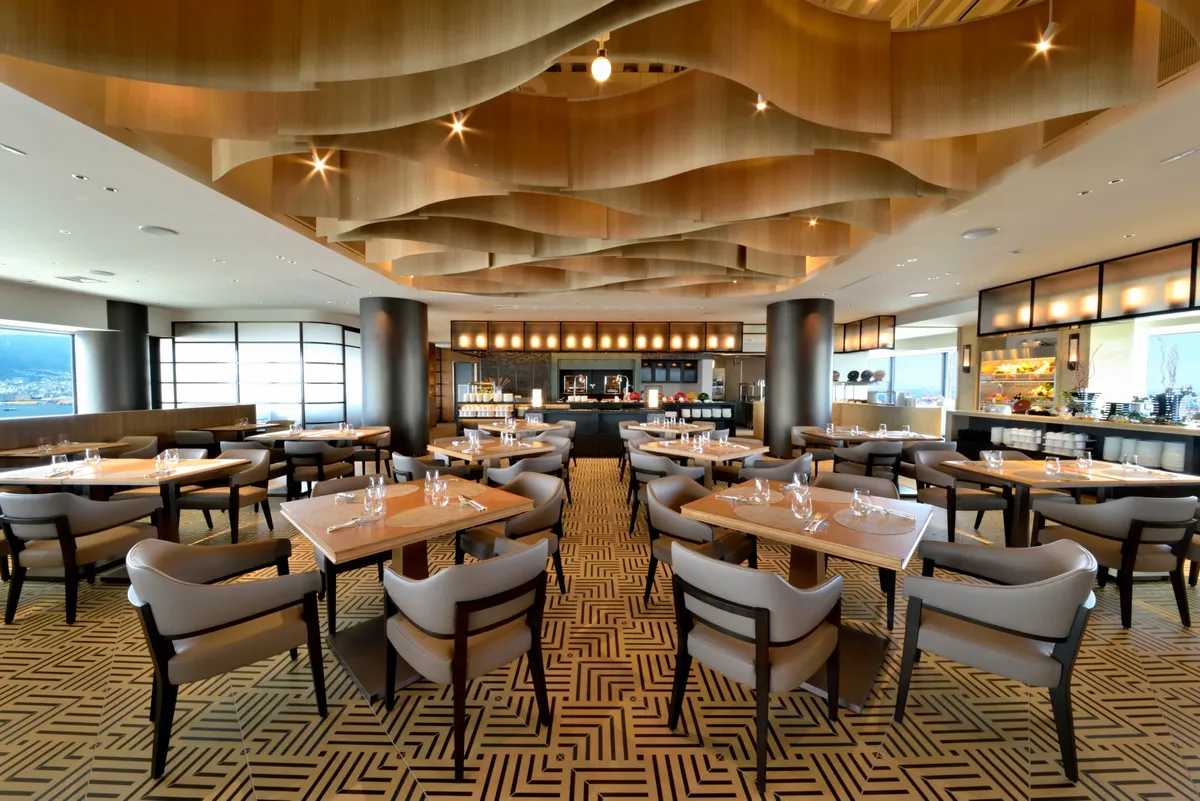 The modern interior of Sky Grill Buffet GOCOCU with a wavy wooden ceiling