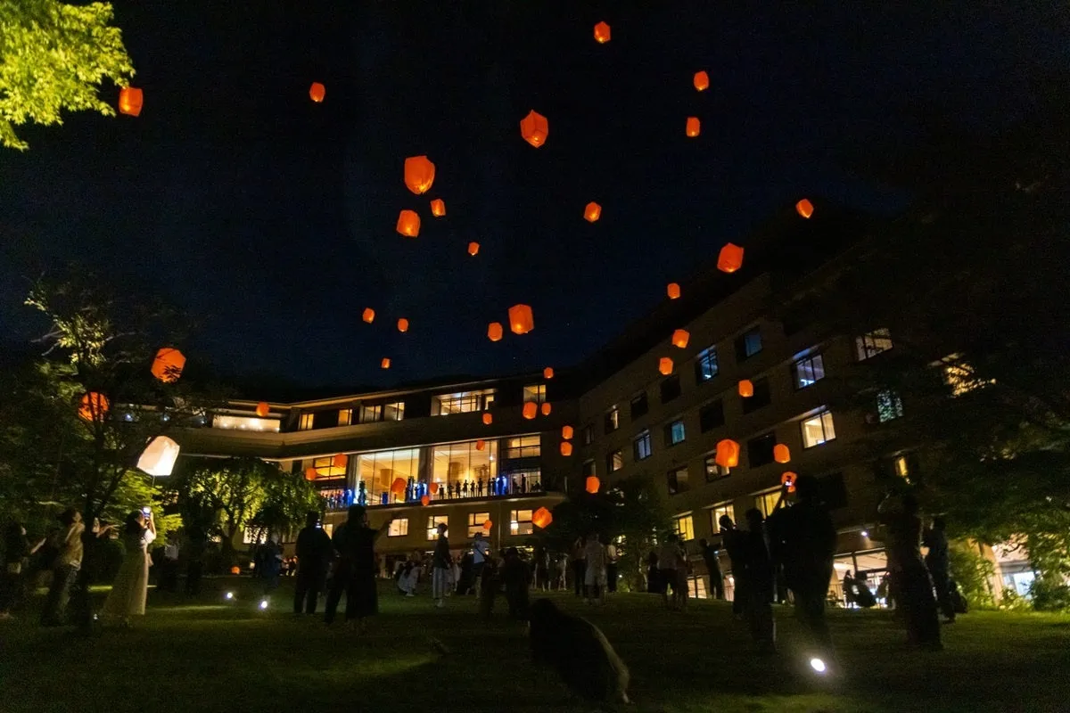 Glowing lanterns released into the night sky
