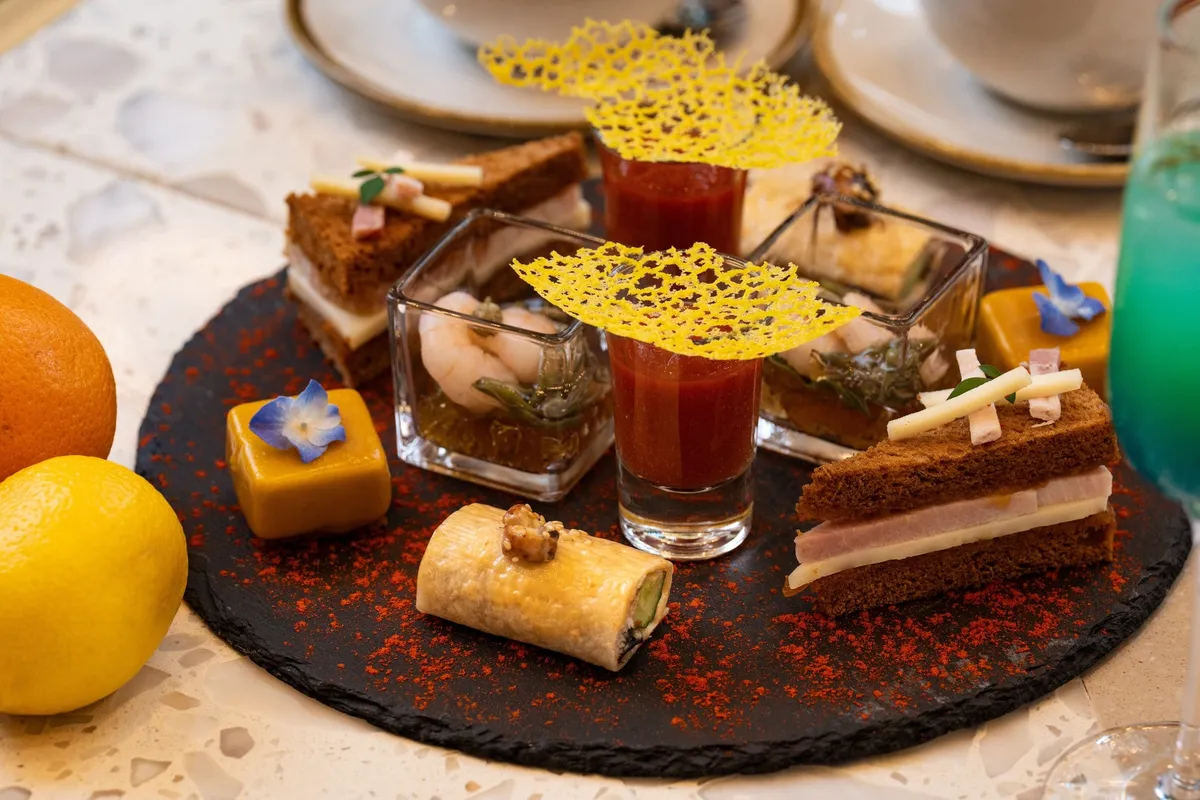 Savory tier with gazpacho and sandwiches
