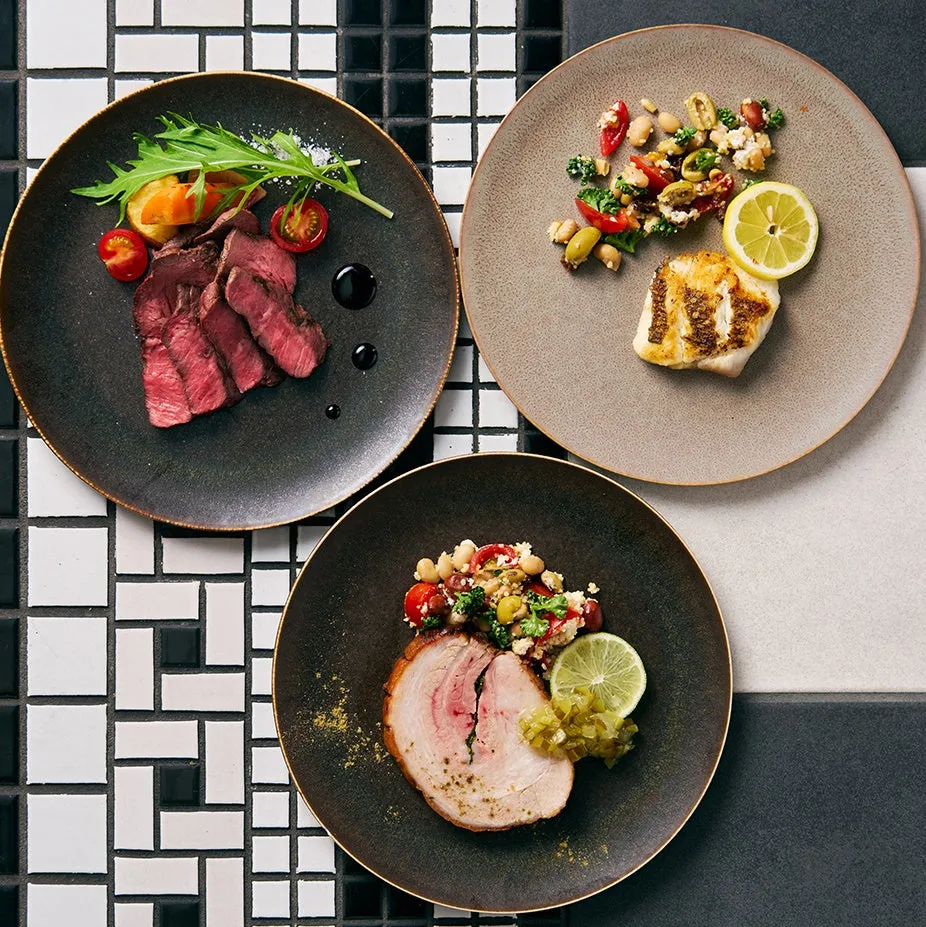 Assorted main dishes including beef and grilled fish