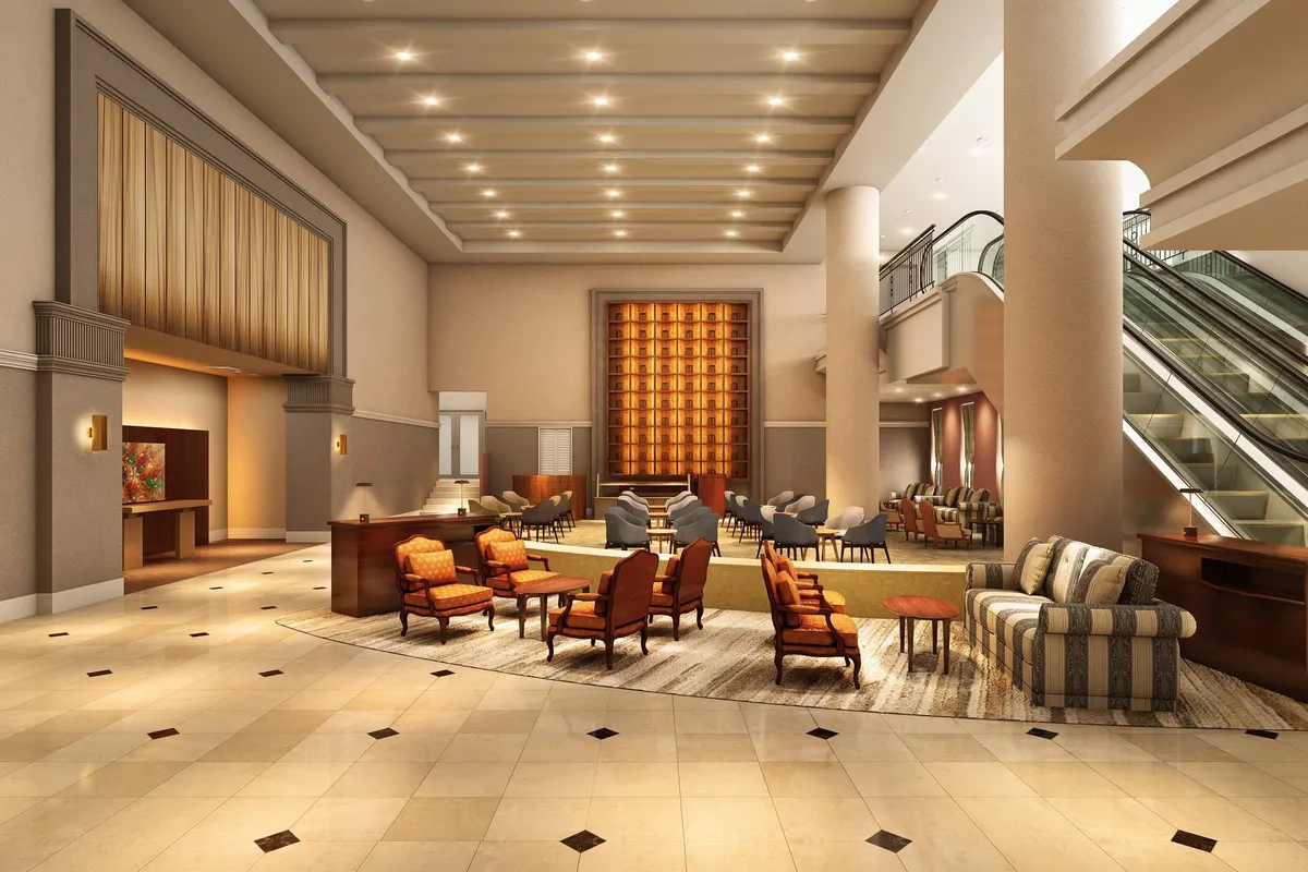 The spacious hotel lobby with high ceilings and an escalator