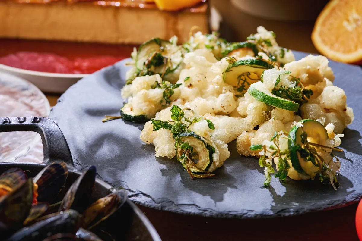 Fried zucchini and seasonal herbs