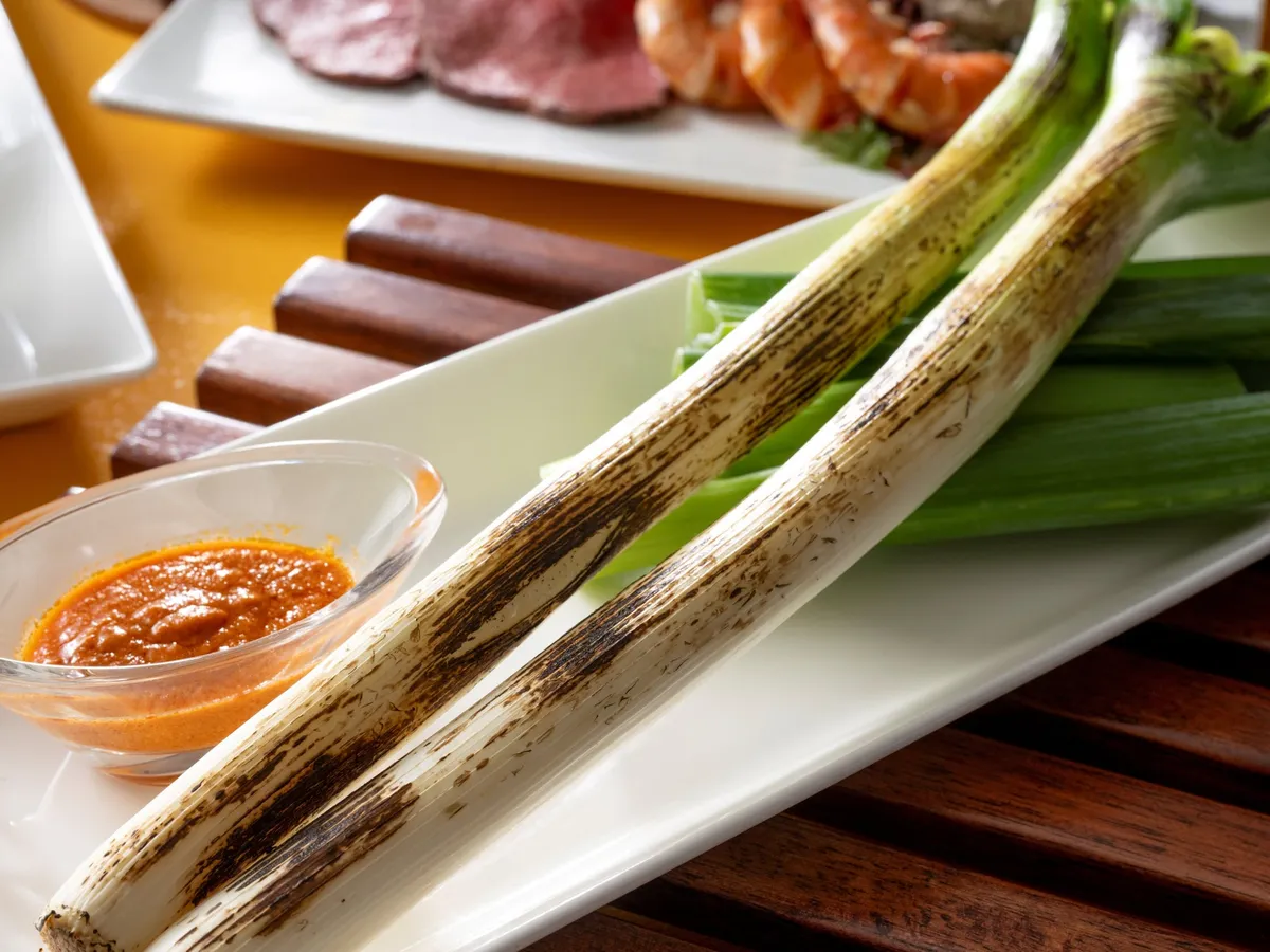 Grilled calçots with romesco sauce