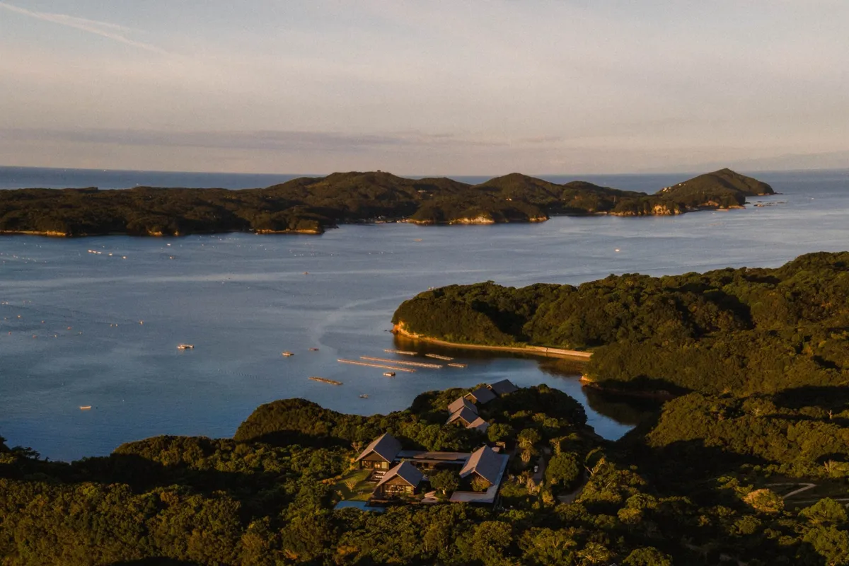An aerial view of Amanemu's low-slung buildings nestled in the greenery of Ise-Shima