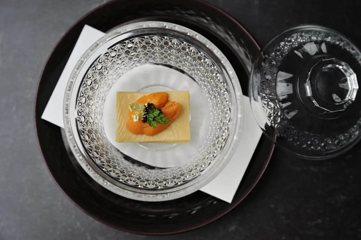 Yuba topped with sea urchin and caviar in a crystal bowl