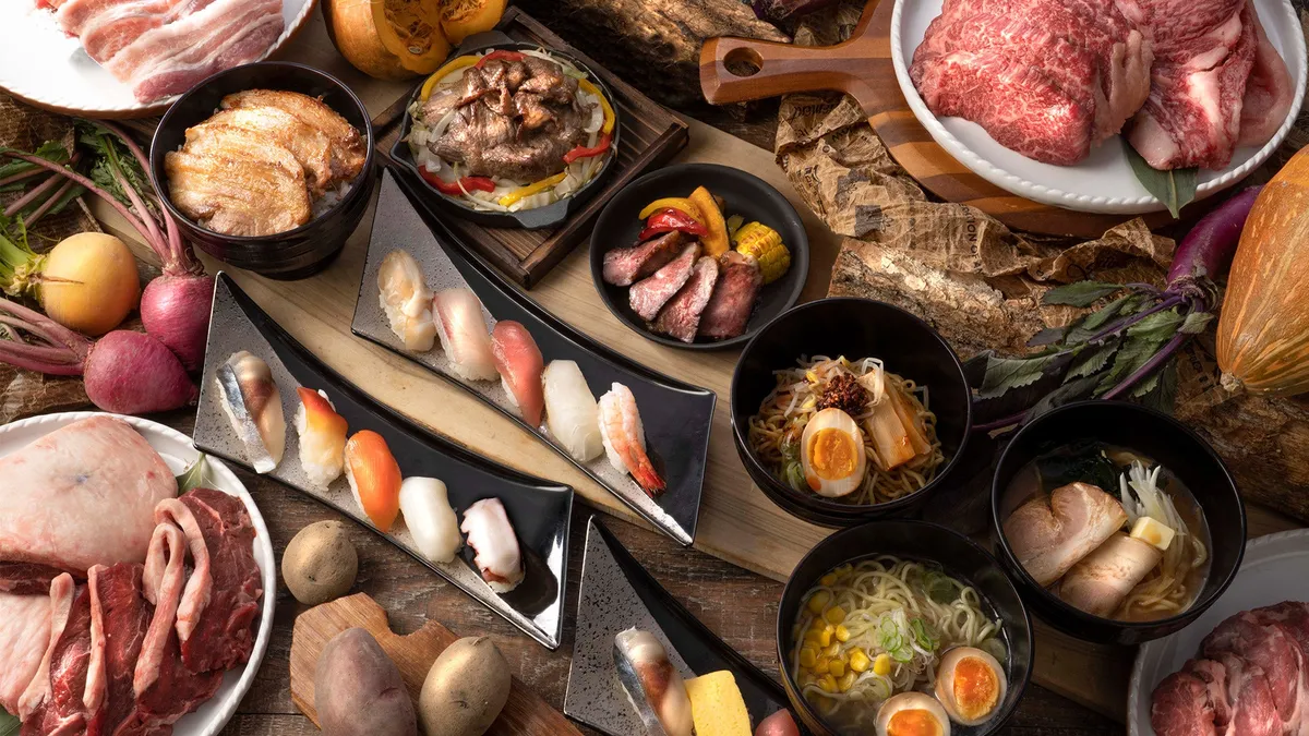 A diverse spread of Hokkaido breakfast items including sushi and ramen