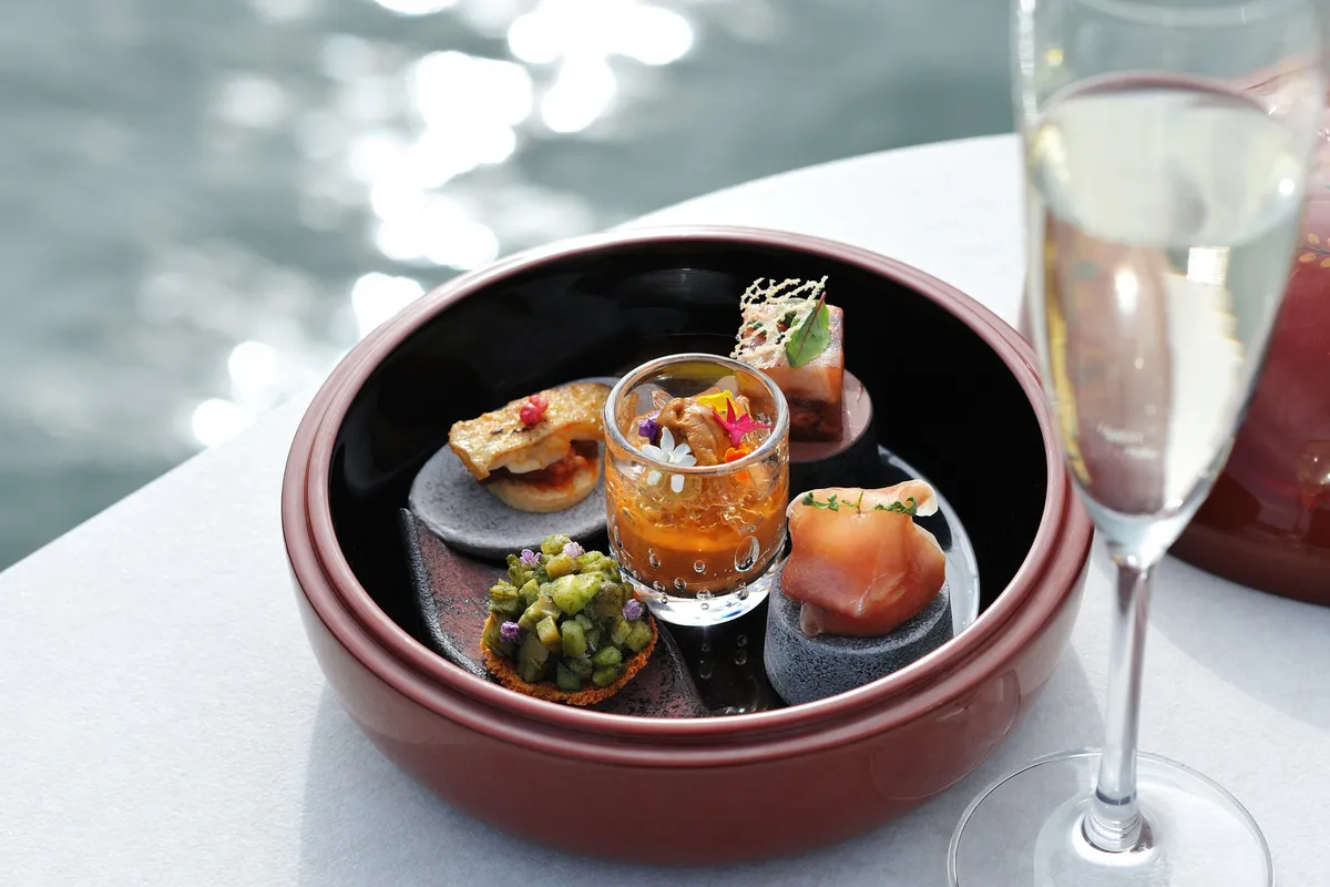 A selection of seasonal appetizers served by the water