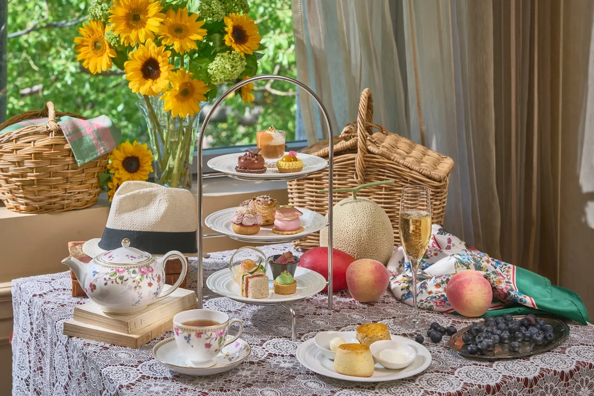 Summer afternoon tea set with sunflowers and picnic baskets