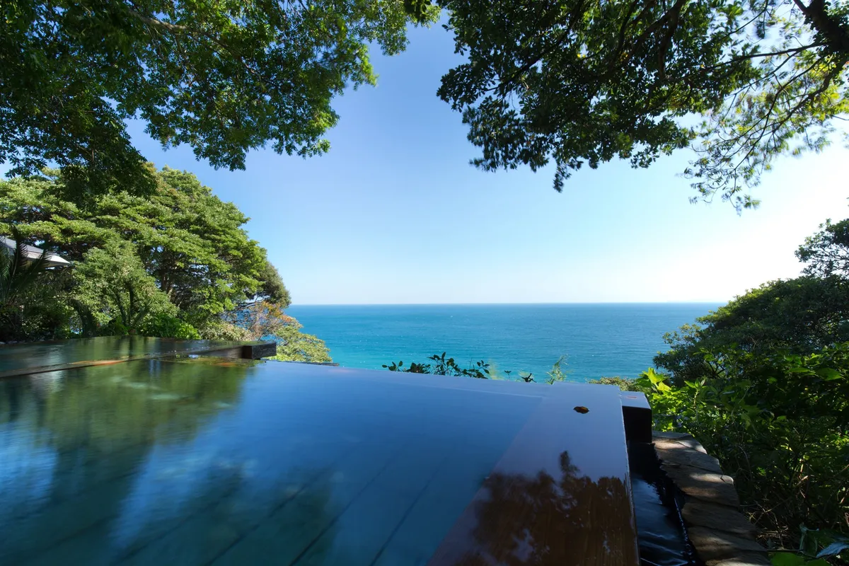 The infinity open-air bath at Kissho CAREN overlooking the sea