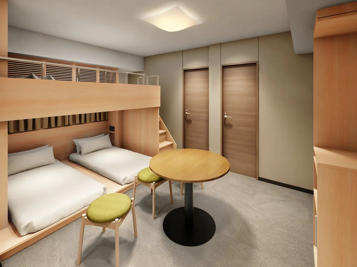 A wood-toned guest room with bunk beds and a central table