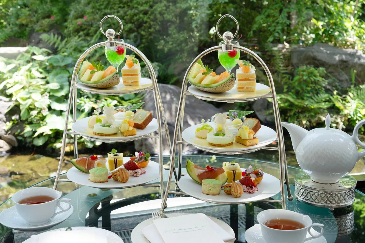 Two afternoon tea stands by a garden window