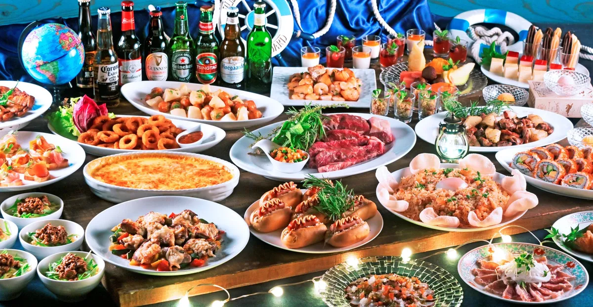 A wide selection of international dishes and bottled beers arranged with cruise-themed decor