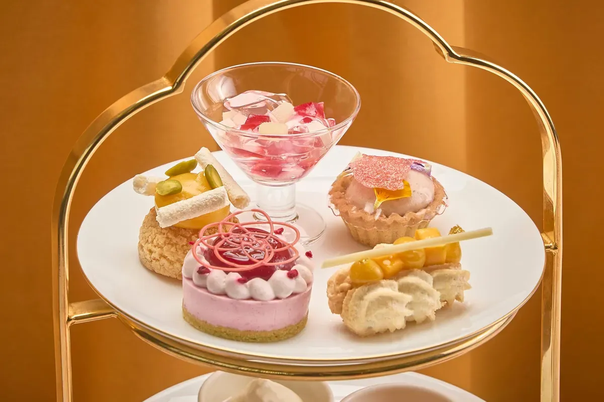 Close-up of the top tier sweets including peach mousse and mango choux