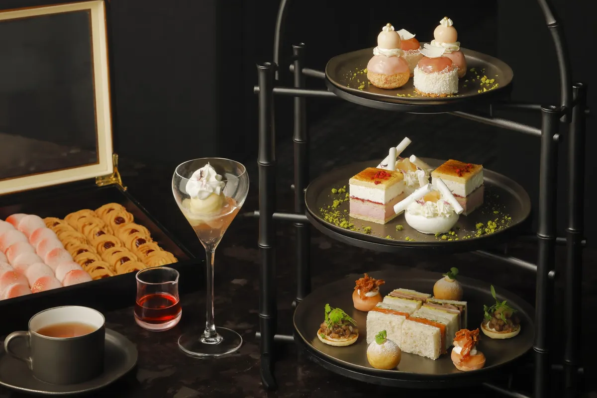 Three-tiered Peach Afternoon Tea stand with sweets and savories