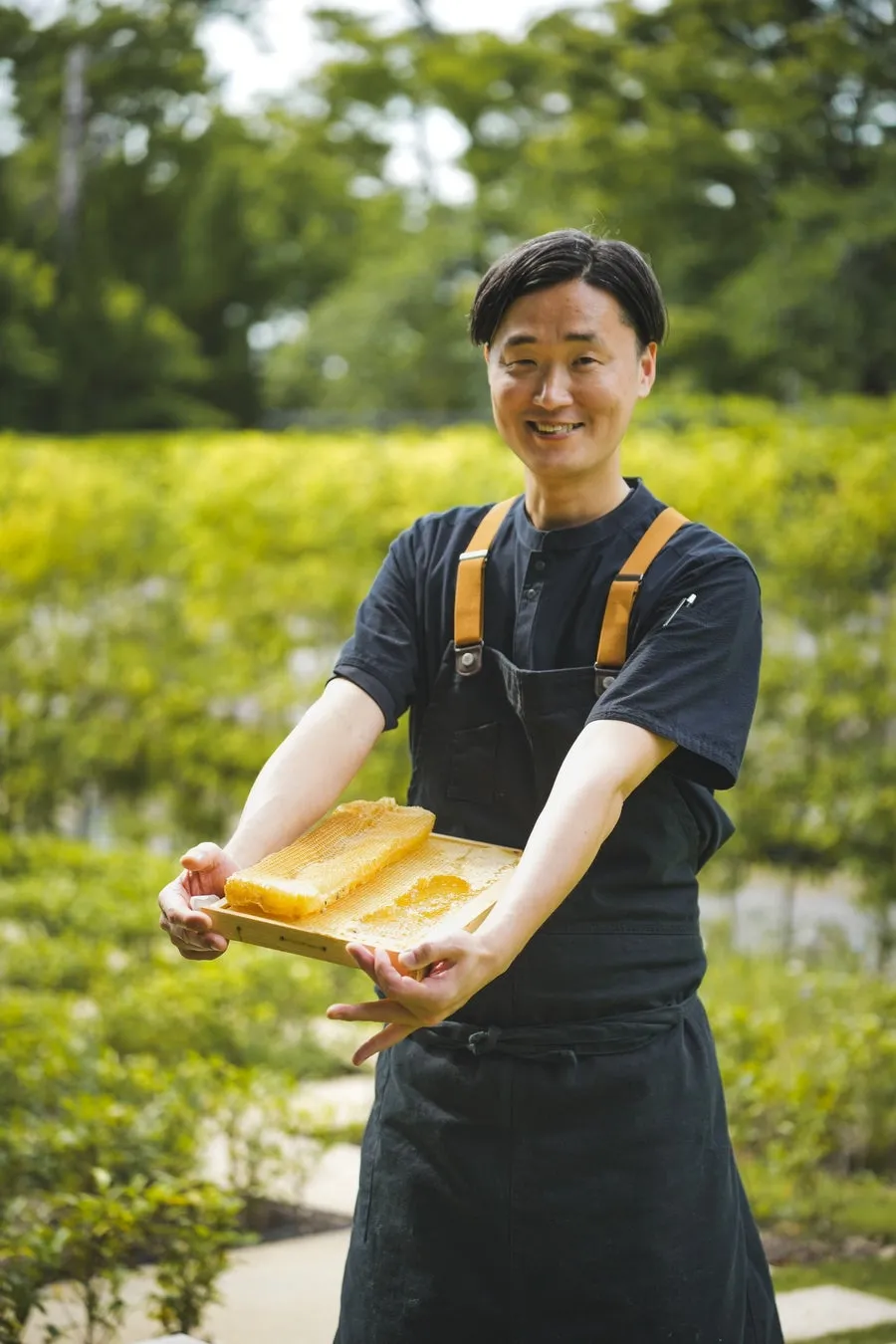 Chef holding a honeycomb tray