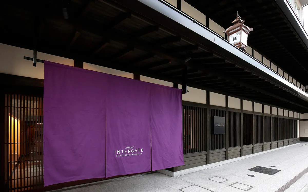 The exterior of Hotel Intergate Kyoto Shijo Shinmachi with a purple curtain