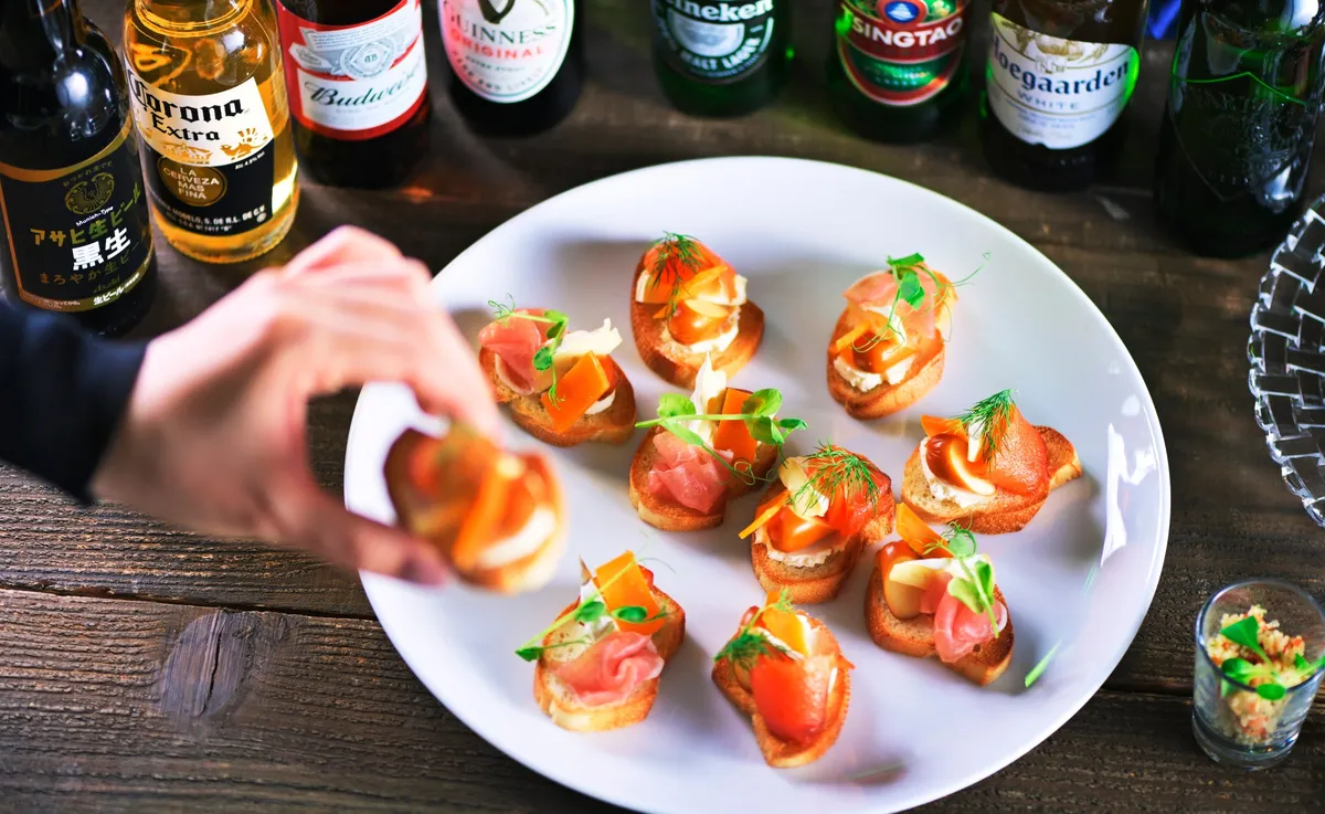 Danish smørrebrød appetizers topped with salmon and herbs