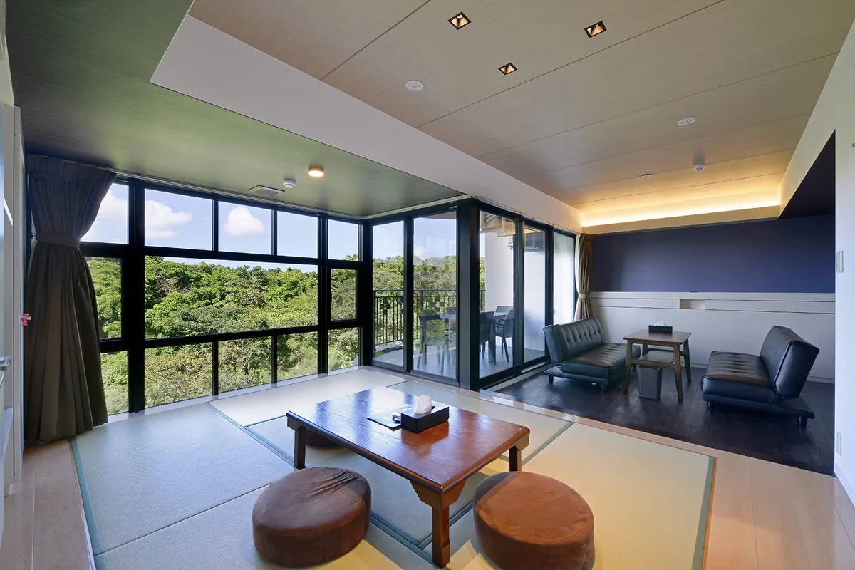 Guest room living area with tatami mats and large windows