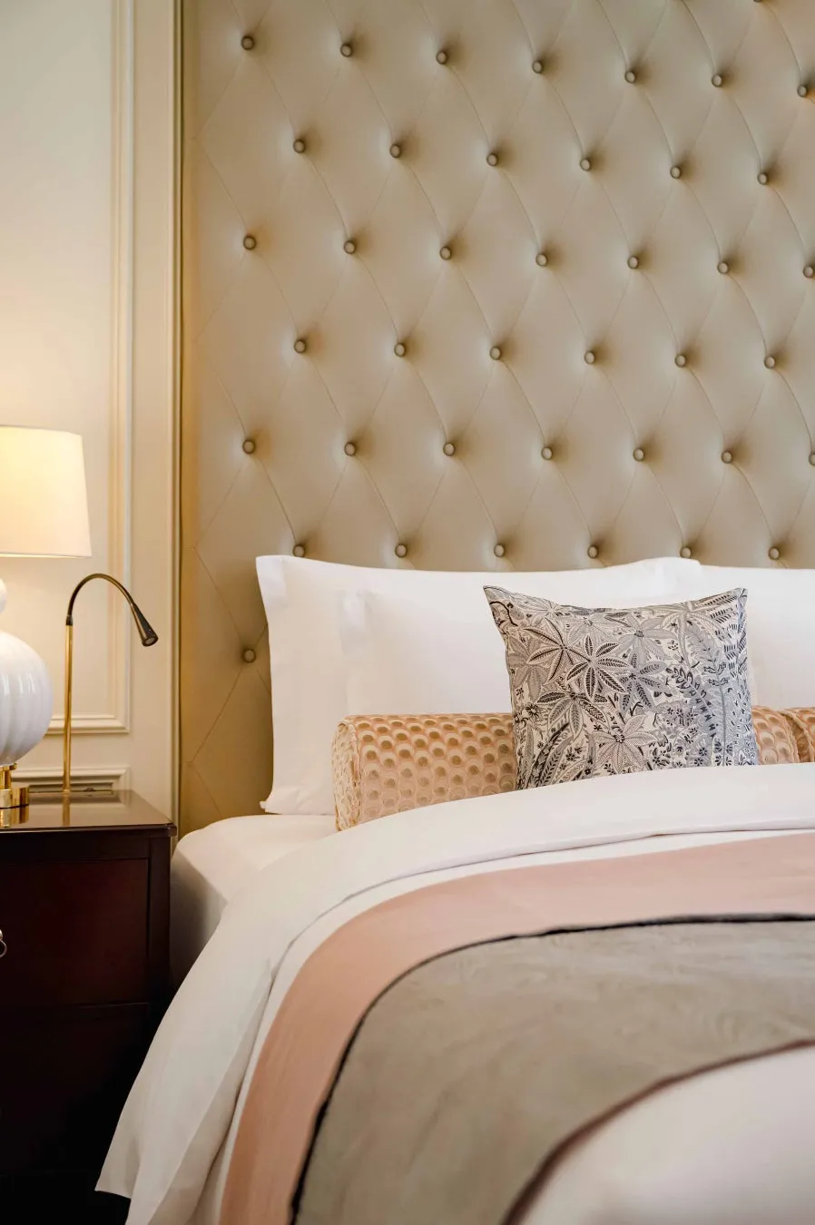 Detail of the HERA room’s bed with peacock feather motif fabrics