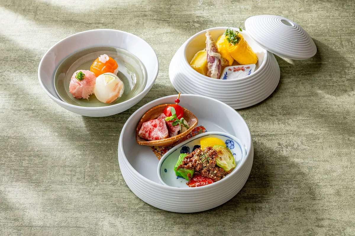 Savory items including temari sushi, wagyu roast beef, and tempura prepared by specialist chefs