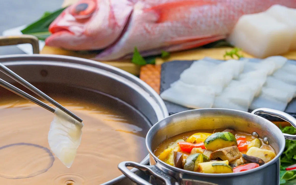 Live kitchen preparation of Tom Yum Goong with Okinawan white fish