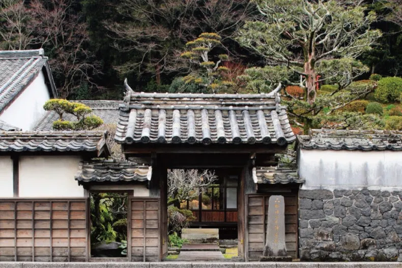 Traditional gate and garden of a historic Japanese property