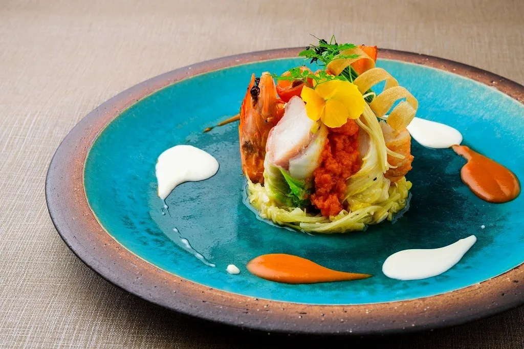 Seafood dish presented on a vibrant turquoise blue Yachimun plate.