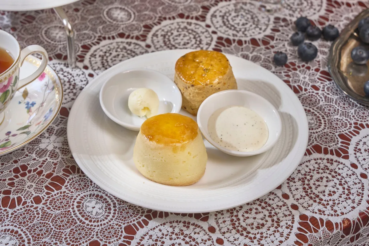 Freshly baked scones with cream and sauce