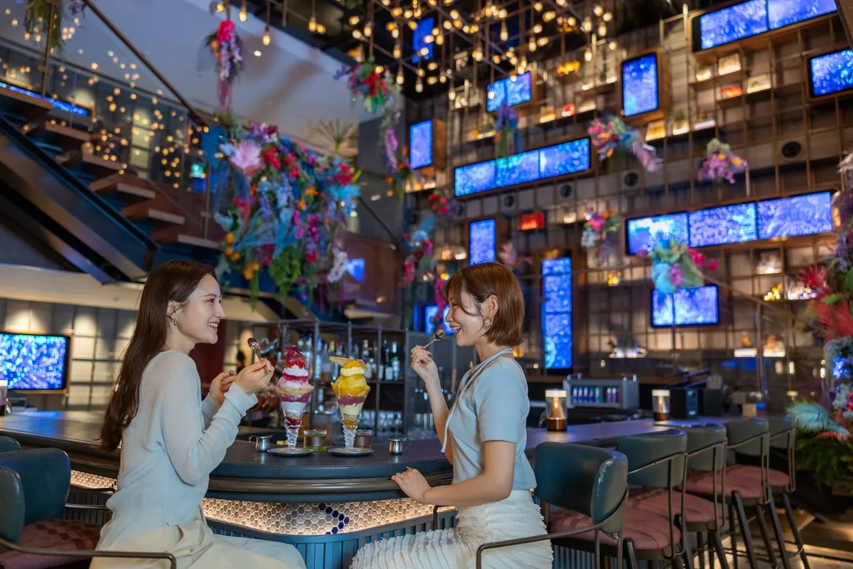 Guests at the bar enjoying shaved ice parfaits