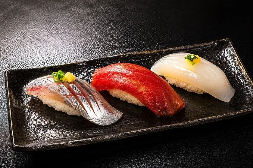 A trio of nigiri sushi featuring local seafood