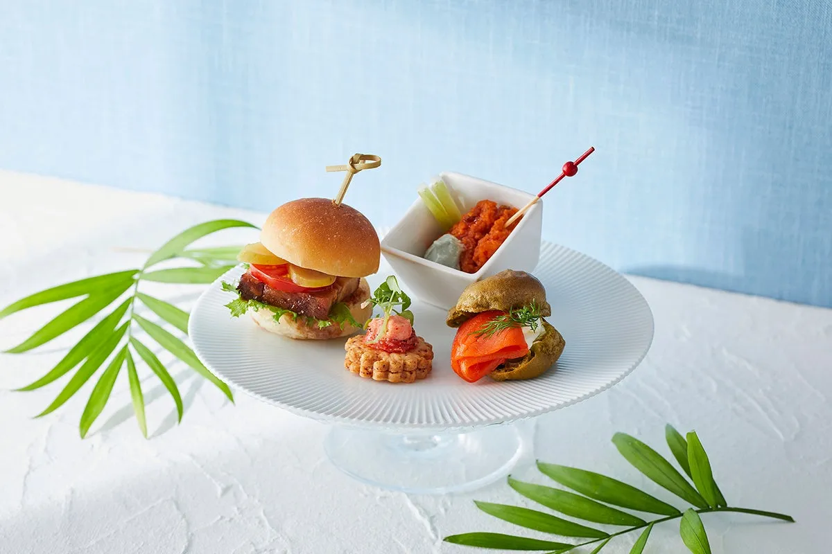 Savory items including a mini burger and salmon choux