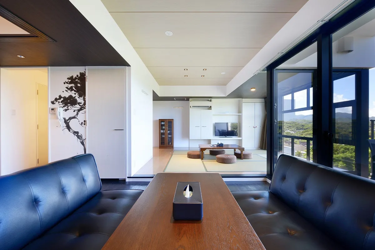 Dining and living space with a view of the forest