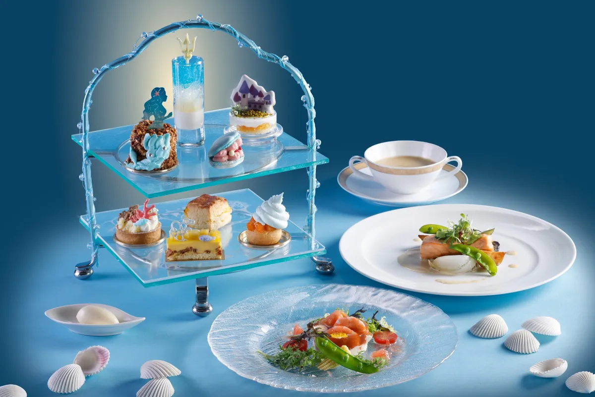 The evening dinner course featuring two tiers of themed desserts
