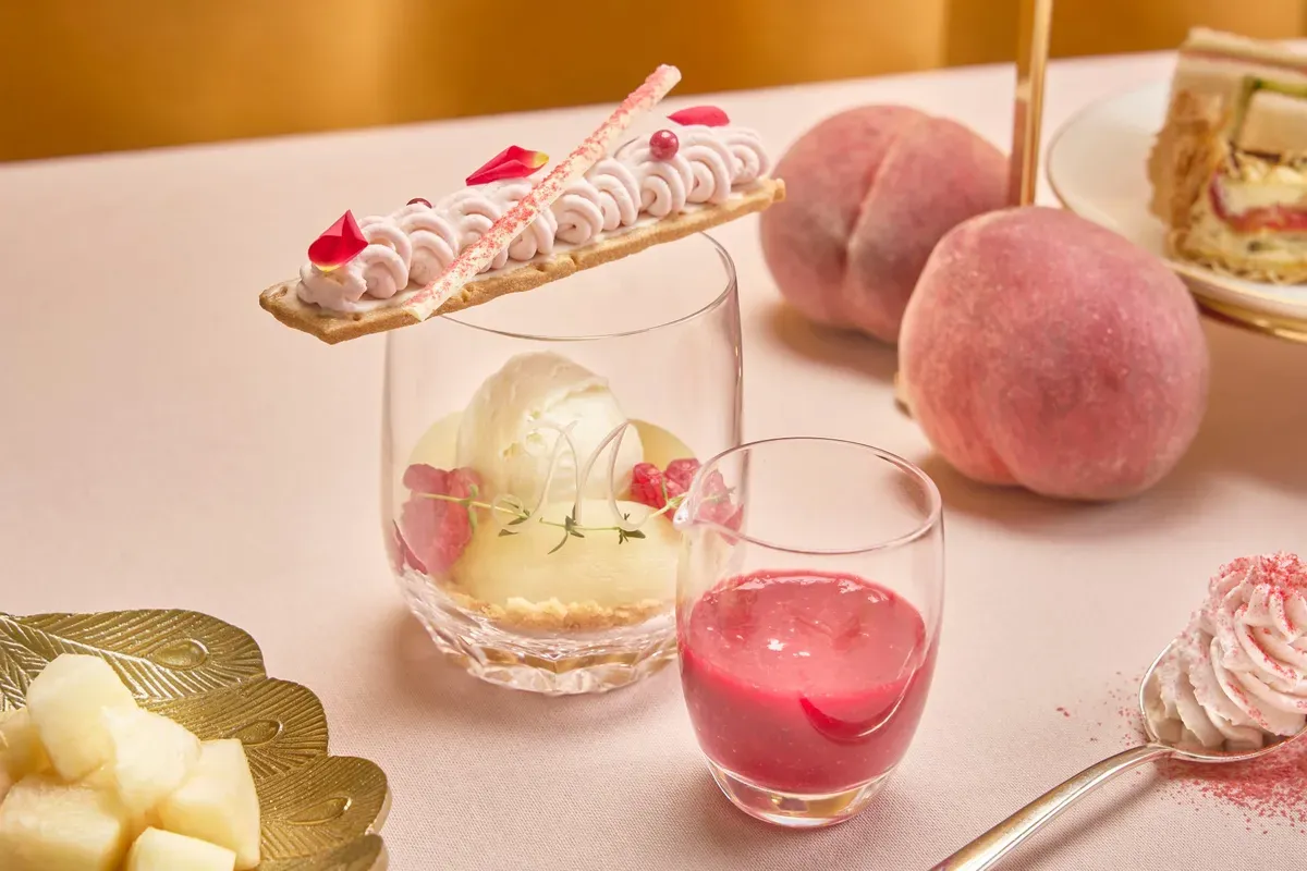The signature Peach Melba served with berry sauce