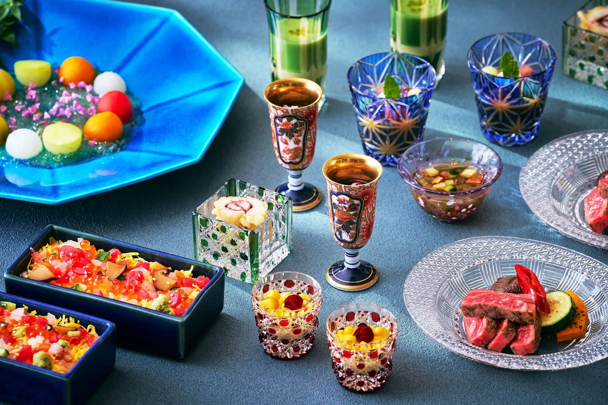 Close-up of chirashi sushi and grilled beef dishes