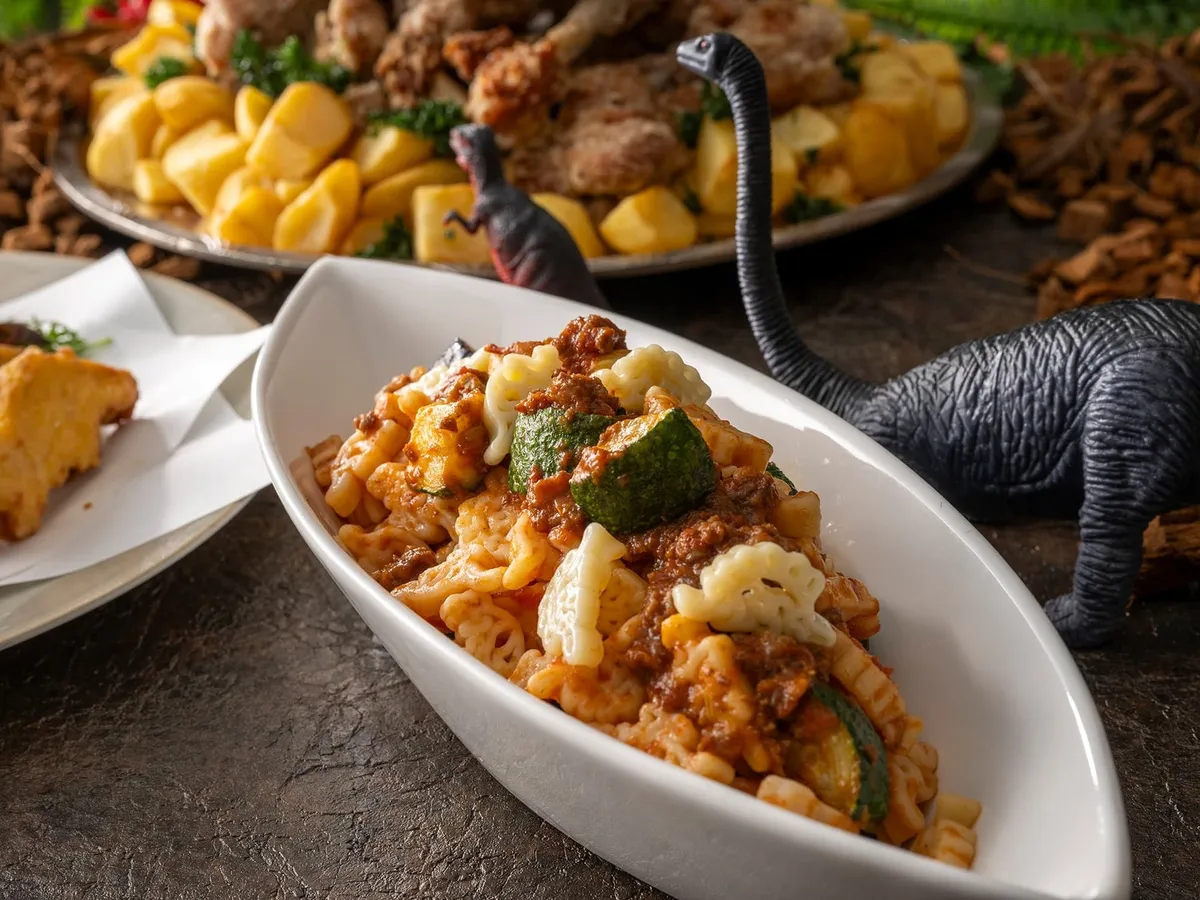 Dinosaur-shaped pasta with meat sauce