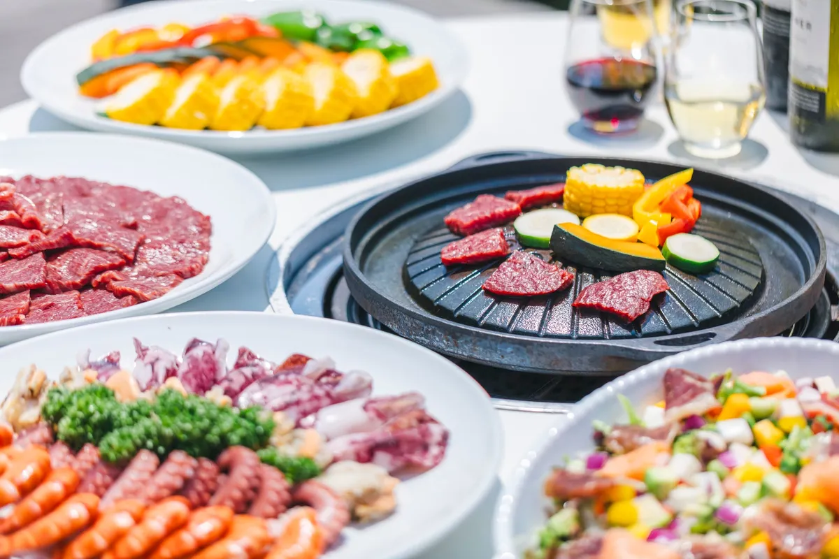 Platters of seafood and salad on the buffet board