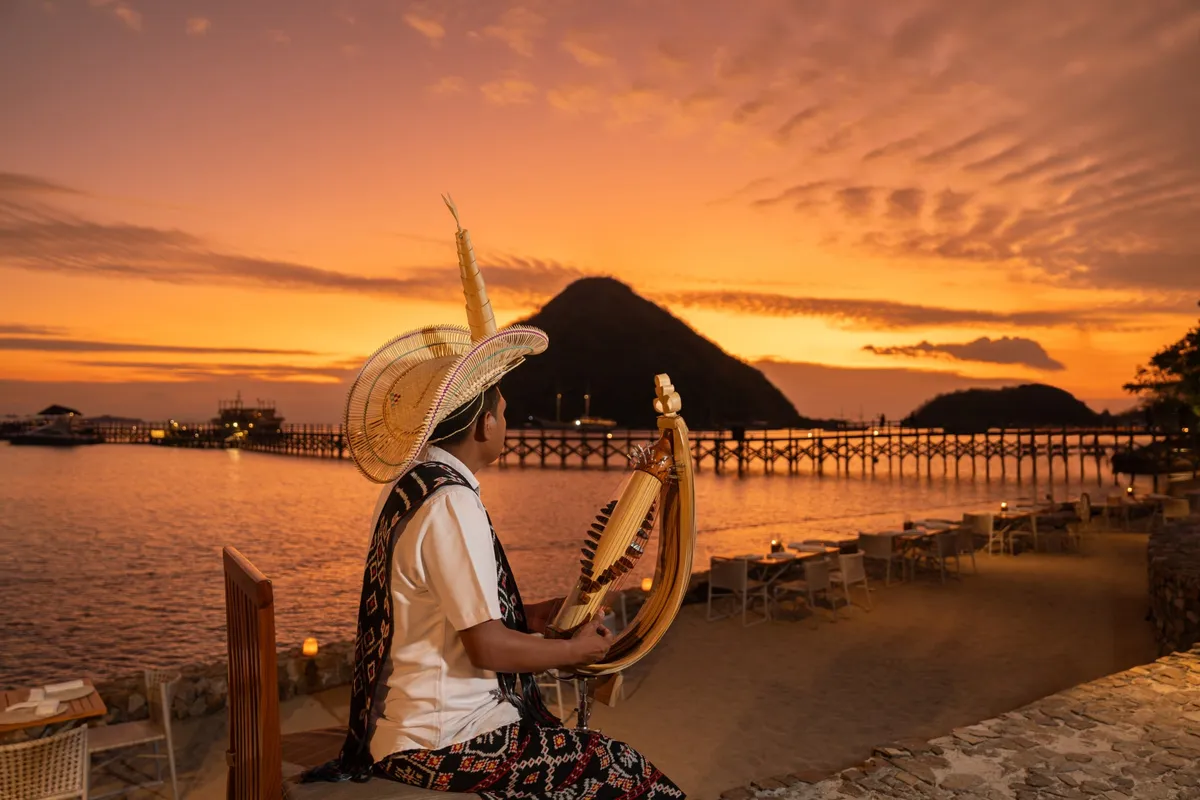 A musician playing the traditional Sasando instrument