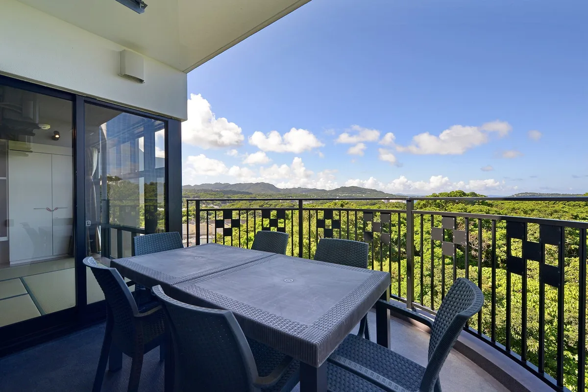 Private balcony with outdoor table and chairs