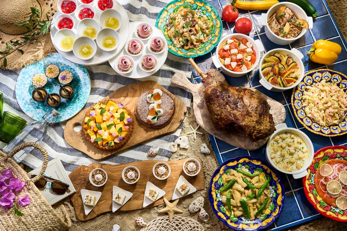 Italian lunch buffet spread with blue tile backdrop