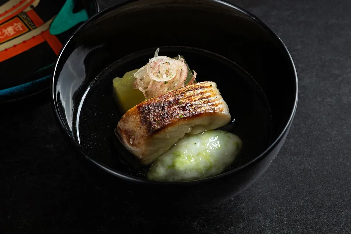 Seared fish in broth