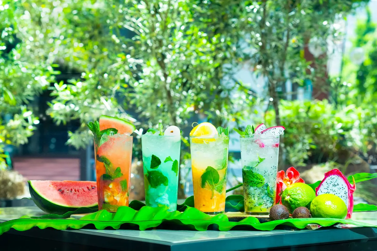 Four colorful fruit-based mojitos