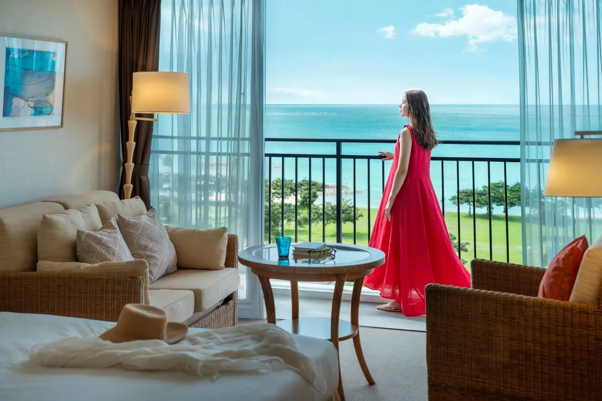 Guest on an ocean view balcony