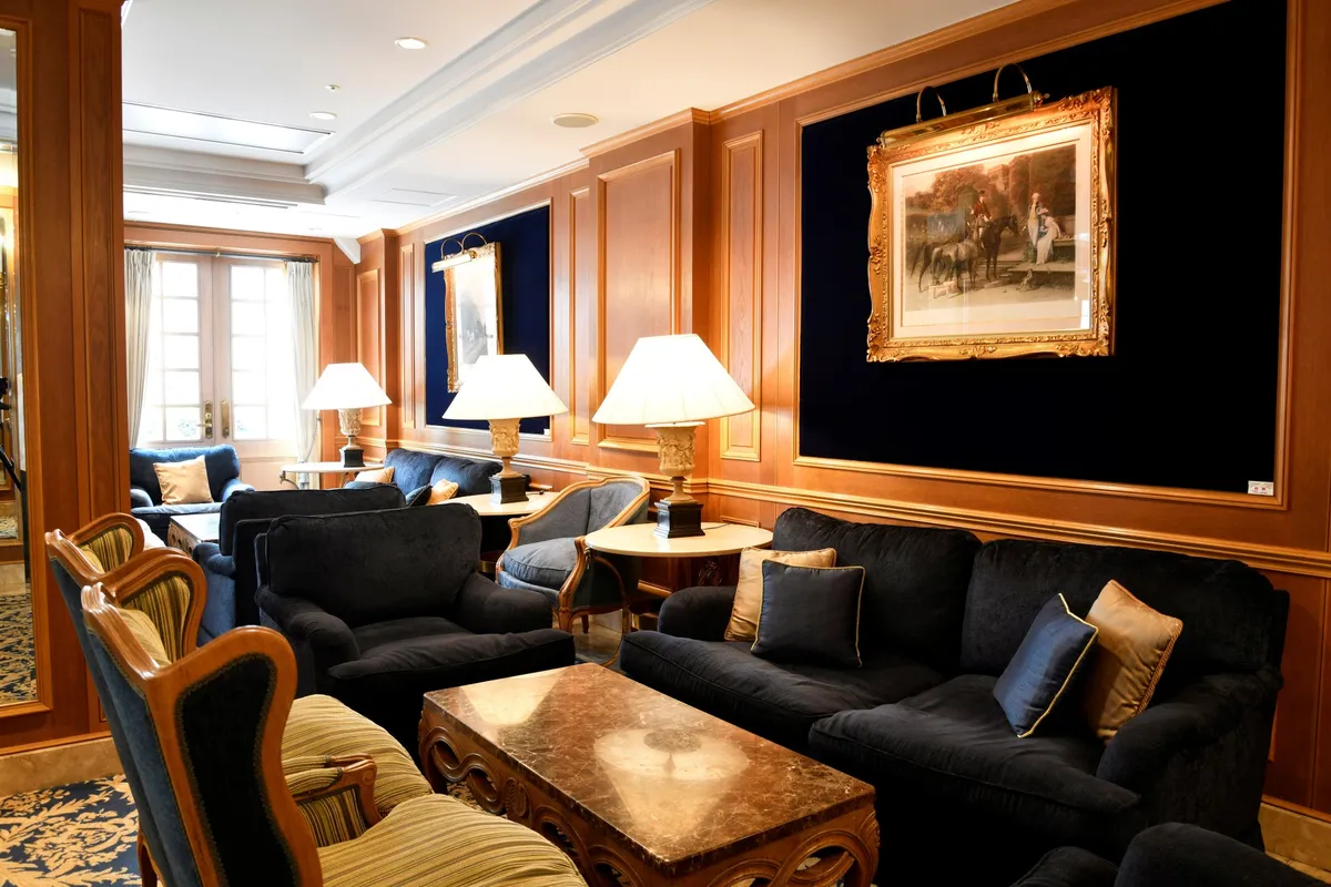 Wood-paneled lounge seating with artwork