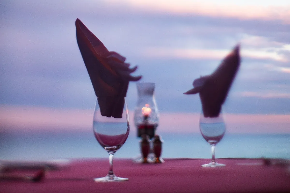 Sunset aperitifs served on the resort terrace