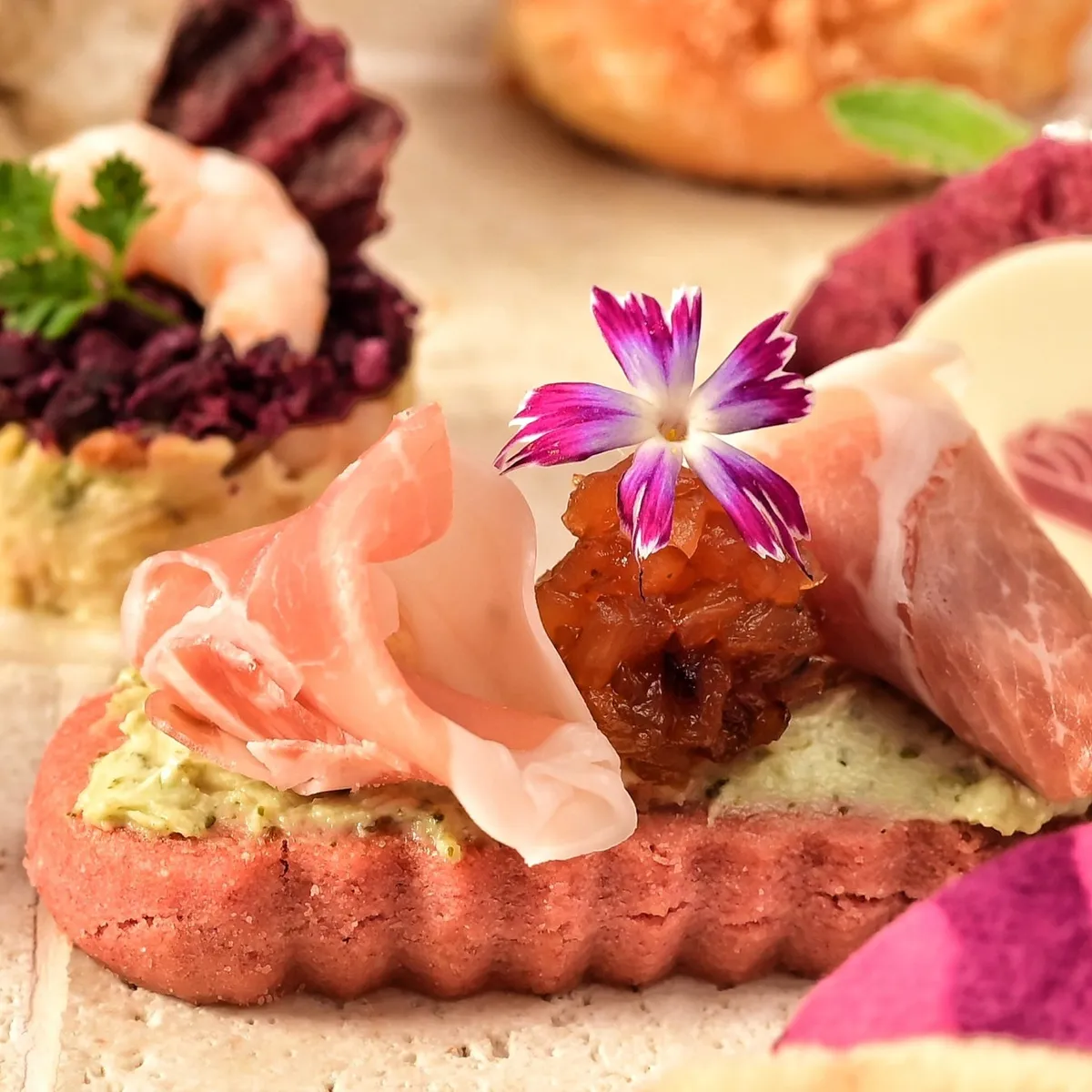 Prosciutto on a red biscuit savory